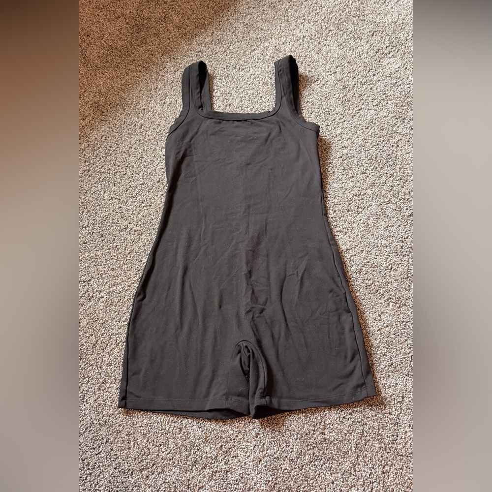 Women's black one piece workout, leisure outfit